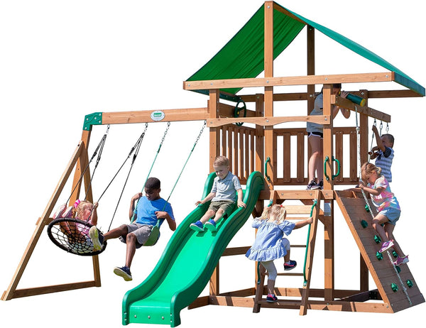 A complete set of wooden mountain-style swings, equipped with a colorful canvas sunshade, a wave slide, a rope swing, a net swing, and a rock wall with climbing ropes and ladders. B6